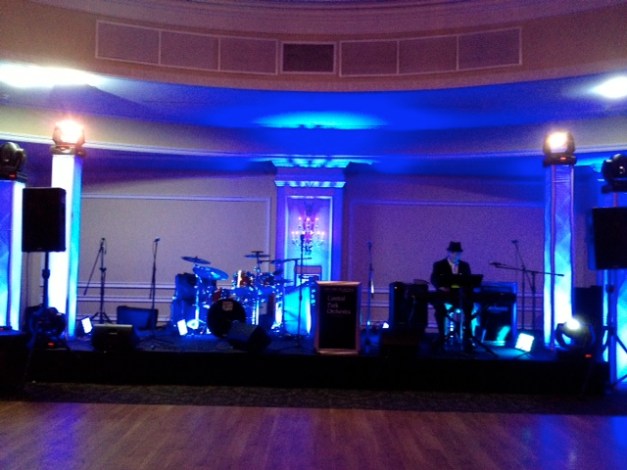 Stage at Oheka Castle with vertical lighting trusses